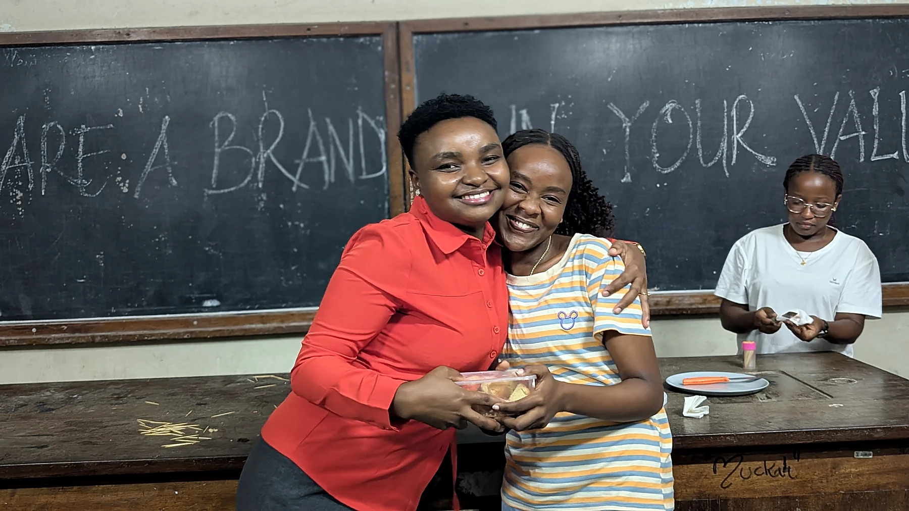 A young participant and a facilitator at an Upekee session